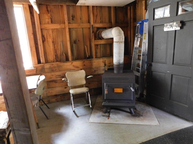 157 Bradley Ln, Mercer, ME 04957 - living room with a wood stove and concrete floors