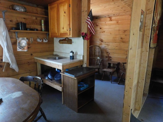 157 Bradley Ln, Mercer, ME 04957 - kitchen with wood walls, open shelves, light countertops, and brown cabinets