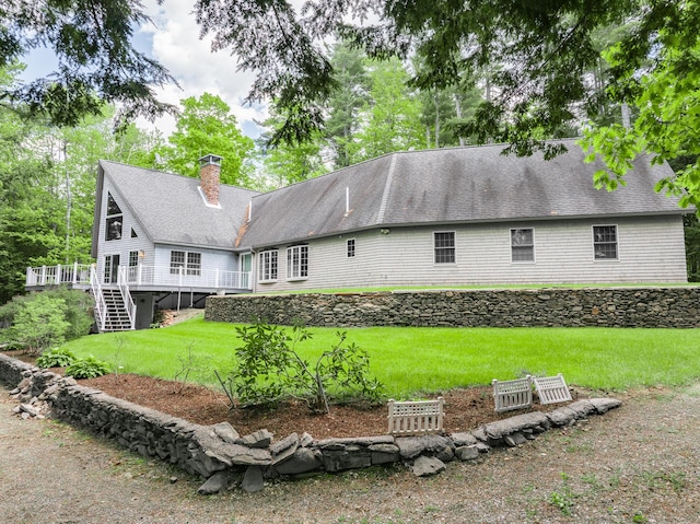 129 Maple Shore Ln, Stetson, ME 04488 - rear view of property featuring a chimney, stairway, a yard, a wooden deck, and a shingled roof