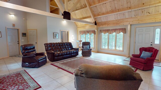 129 Maple Shore Ln, Stetson, ME 04488 - living room featuring light tile patterned floors, high vaulted ceiling, and wooden ceiling with exposed beams