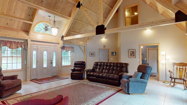 129 Maple Shore Ln, Stetson, ME 04488 - living area with high vaulted ceiling, tile patterned floors, wooden ceiling with exposed beams, and baseboards