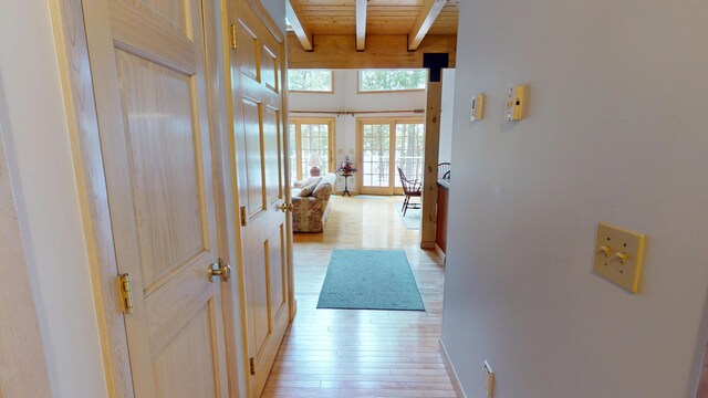 129 Maple Shore Ln, Stetson, ME 04488 - hall with light wood-type flooring, wood ceiling with exposed beams, french doors, and baseboards