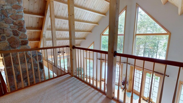 129 Maple Shore Ln, Stetson, ME 04488 - hall featuring wooden ceiling with exposed beams, high vaulted ceiling, and carpet floors
