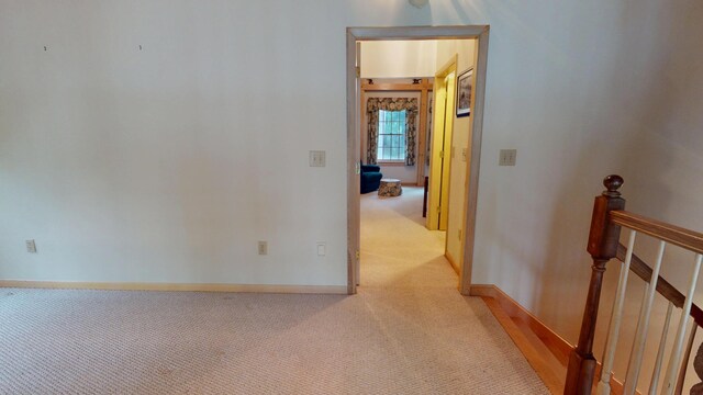 129 Maple Shore Ln, Stetson, ME 04488 - corridor featuring light carpet and baseboards