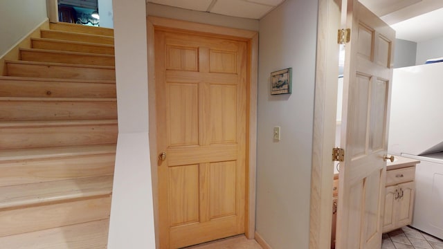 129 Maple Shore Ln, Stetson, ME 04488 - hall with stairway and light tile patterned floors