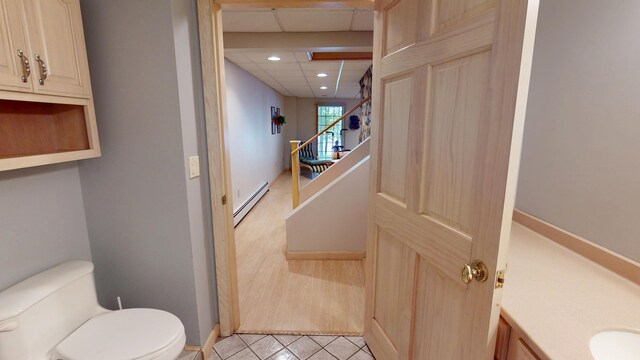 129 Maple Shore Ln, Stetson, ME 04488 - bathroom with baseboard heating, toilet, recessed lighting, vanity, and tile patterned floors