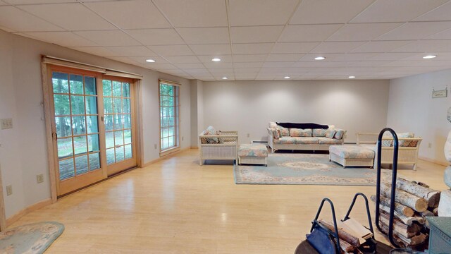 129 Maple Shore Ln, Stetson, ME 04488 - living room featuring wood finished floors, recessed lighting, a drop ceiling, baseboards, and a baseboard heating unit