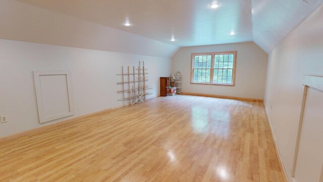 129 Maple Shore Ln, Stetson, ME 04488 - additional living space featuring light wood-style floors, vaulted ceiling, and baseboards