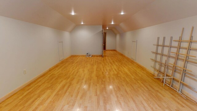 129 Maple Shore Ln, Stetson, ME 04488 - additional living space with wood finished floors, vaulted ceiling, and baseboards