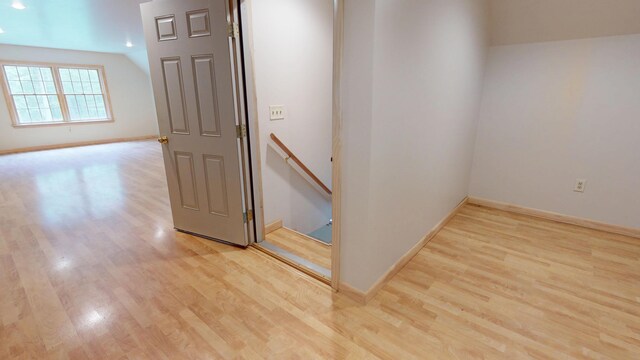 129 Maple Shore Ln, Stetson, ME 04488 - corridor with an upstairs landing, light wood-type flooring, and baseboards