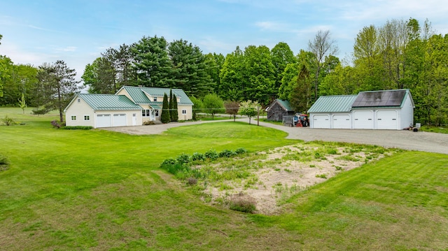 303 Williams Rd, Bradford, ME 04410 - view of yard featuring an outdoor structure, dirt driveway, and a garage