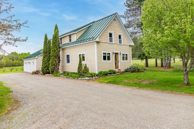 303 Williams Rd, Bradford, ME 04410 - view of property exterior with a standing seam roof, a metal roof, and a yard