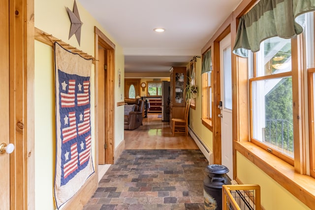303 Williams Rd, Bradford, ME 04410 - hallway with plenty of natural light, a baseboard radiator, recessed lighting, and dark stone finish flooring