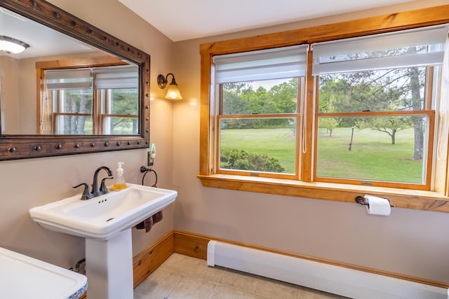 303 Williams Rd, Bradford, ME 04410 - bathroom featuring a baseboard heating unit and tile patterned floors