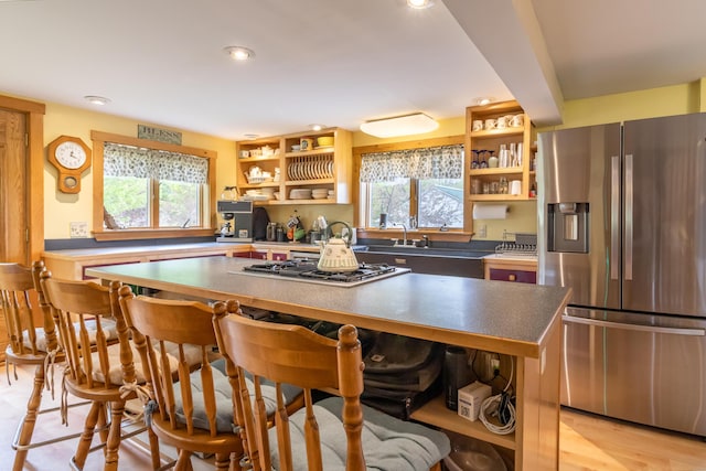 303 Williams Rd, Bradford, ME 04410 - kitchen featuring stainless steel appliances, open shelves, a center island, recessed lighting, and a kitchen bar