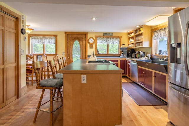 303 Williams Rd, Bradford, ME 04410 - kitchen featuring stainless steel appliances, plenty of natural light, a center island, light wood-style floors, and recessed lighting