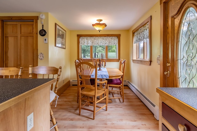 303 Williams Rd, Bradford, ME 04410 - dining room with a baseboard radiator and light wood-type flooring