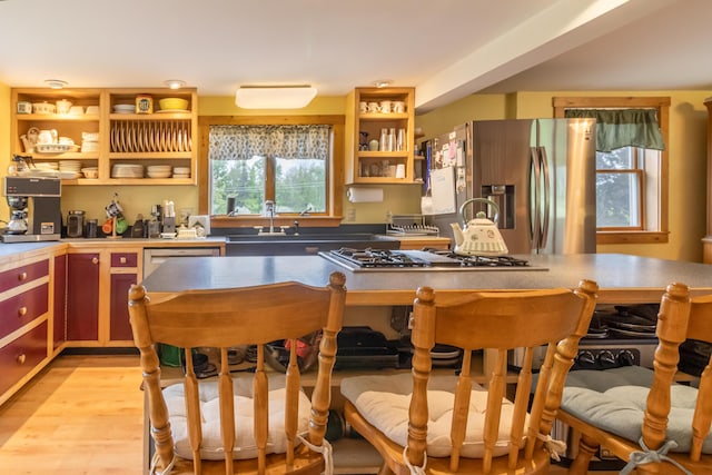 303 Williams Rd, Bradford, ME 04410 - kitchen with appliances with stainless steel finishes, open shelves, and light wood-style flooring