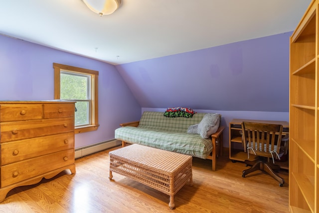 303 Williams Rd, Bradford, ME 04410 - bedroom featuring a baseboard radiator, light wood-style floors, and lofted ceiling