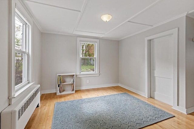20 Donald St, Waterville, ME 04901 - unfurnished bedroom with radiator, wood finished floors, baseboards, and ornamental molding