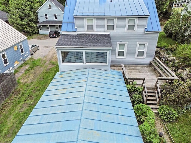 20 Donald St, Waterville, ME 04901 - rear view of property featuring a standing seam roof, metal roof, and stairs