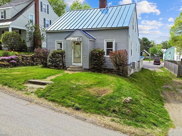 20 Donald St, Waterville, ME 04901 - view of front facade with a standing seam roof, a chimney, and metal roof