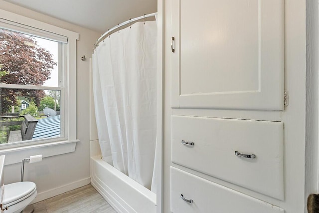 20 Donald St, Waterville, ME 04901 - bathroom featuring toilet, baseboards, wood finished floors, and shower / bath combination with curtain