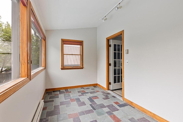 20 Donald St, Waterville, ME 04901 - unfurnished sunroom with vaulted ceiling, rail lighting, and a baseboard radiator