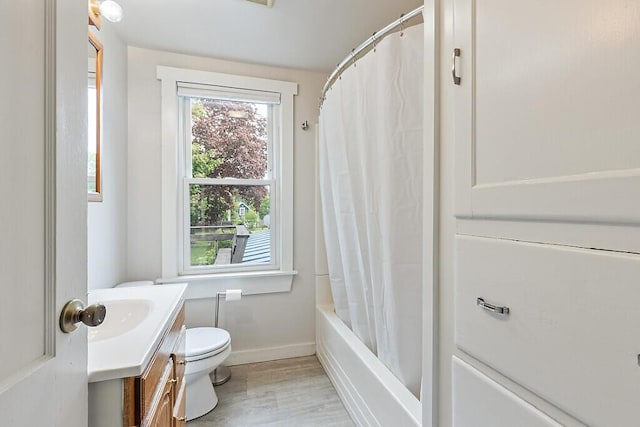 20 Donald St, Waterville, ME 04901 - bathroom with vanity, baseboards, toilet, wood finished floors, and shower / tub combo
