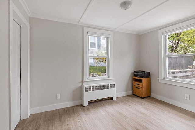 20 Donald St, Waterville, ME 04901 - unfurnished room featuring radiator, plenty of natural light, wood finished floors, ornamental molding, and baseboards