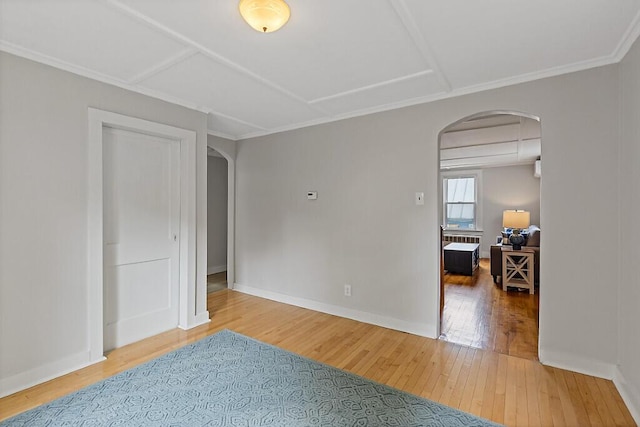 20 Donald St, Waterville, ME 04901 - empty room with arched walkways, wood-type flooring, baseboards, and ornamental molding
