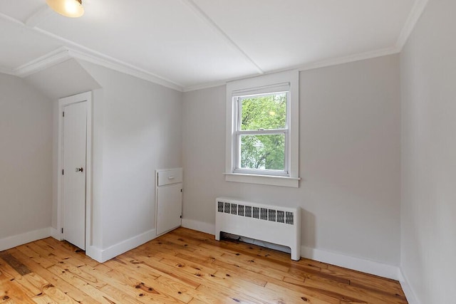 20 Donald St, Waterville, ME 04901 - spare room with radiator, light wood-style floors, baseboards, and crown molding