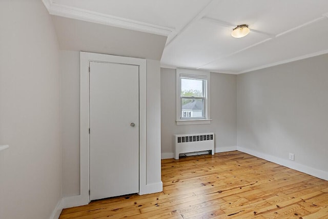 20 Donald St, Waterville, ME 04901 - unfurnished bedroom with radiator heating unit, light wood-style floors, baseboards, and ornamental molding