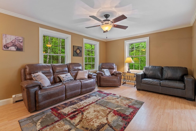 15 Convene Rd, Sebago, ME 04029 - living room with baseboard heating, light wood-style floors, ornamental molding, ceiling fan, and baseboards