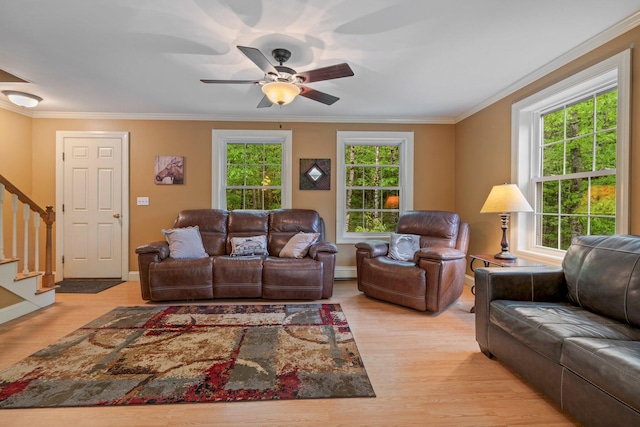 15 Convene Rd, Sebago, ME 04029 - living room with light wood-style floors, stairway, crown molding, ceiling fan, and baseboards