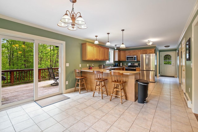 15 Convene Rd, Sebago, ME 04029 - kitchen featuring appliances with stainless steel finishes, a peninsula, light tile patterned flooring, crown molding, and a chandelier