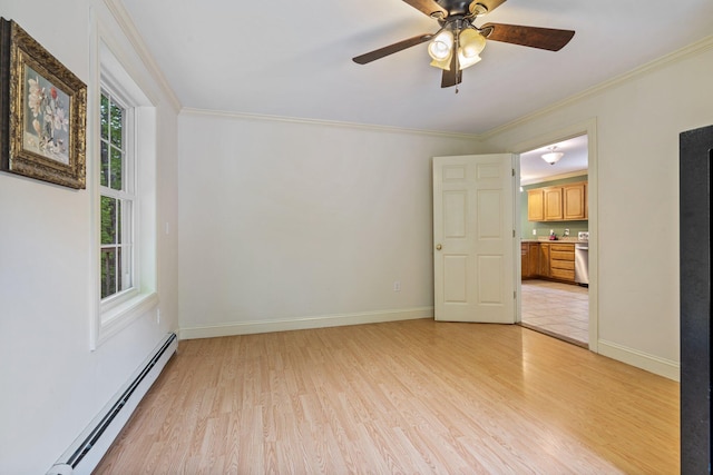 15 Convene Rd, Sebago, ME 04029 - spare room with a baseboard radiator, light wood-style floors, a ceiling fan, ornamental molding, and baseboards