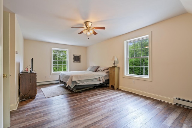 15 Convene Rd, Sebago, ME 04029 - bedroom with baseboard heating, hardwood / wood-style floors, baseboards, a baseboard heating unit, and ceiling fan