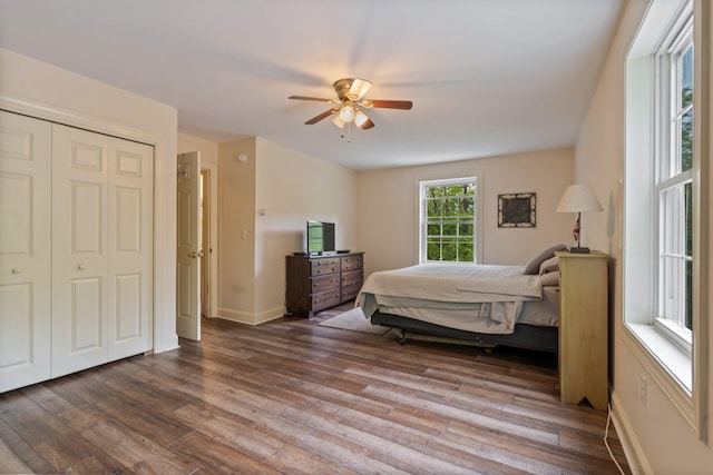 15 Convene Rd, Sebago, ME 04029 - bedroom with wood finished floors, a ceiling fan, baseboards, and a closet