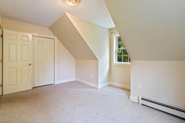 15 Convene Rd, Sebago, ME 04029 - additional living space with baseboard heating, carpet flooring, vaulted ceiling, and baseboards
