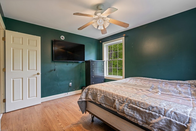 15 Convene Rd, Sebago, ME 04029 - bedroom with wood finished floors, a ceiling fan, and baseboards