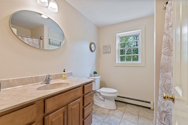 15 Convene Rd, Sebago, ME 04029 - bathroom with a baseboard heating unit, vanity, toilet, and tile patterned floors