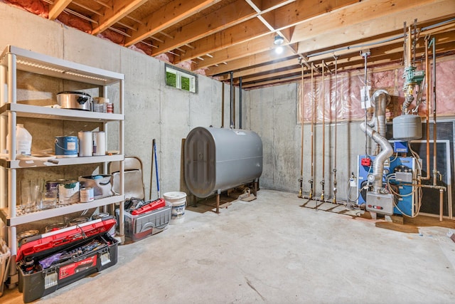 15 Convene Rd, Sebago, ME 04029 - unfinished below grade area with oil tank and a heating unit