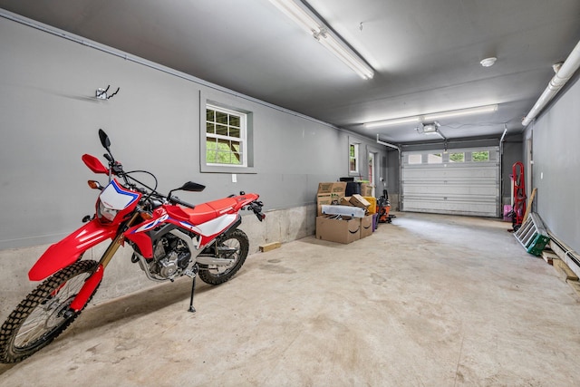 15 Convene Rd, Sebago, ME 04029 - garage featuring a garage door opener