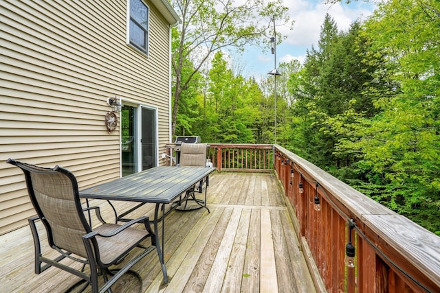 15 Convene Rd, Sebago, ME 04029 - wooden terrace featuring outdoor dining space and area for grilling