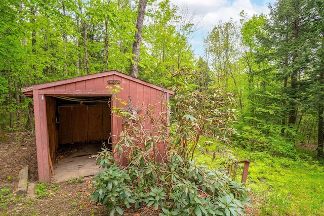 15 Convene Rd, Sebago, ME 04029 - view of shed featuring a wooded view