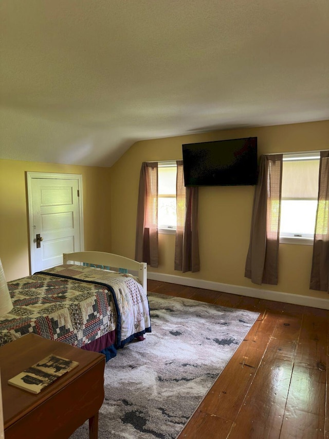 10 Research Dr, Skowhegan, ME 04976 - bedroom with wood-type flooring, vaulted ceiling, and baseboards