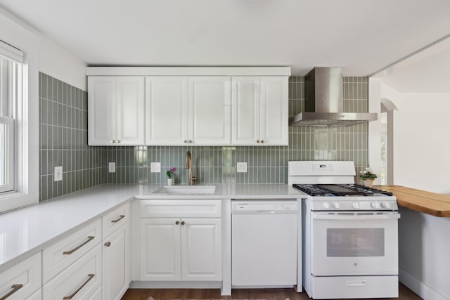 90 Wellington Rd, Portland, ME 04103 - kitchen with white appliances, wall chimney exhaust hood, a sink, light countertops, and white cabinets