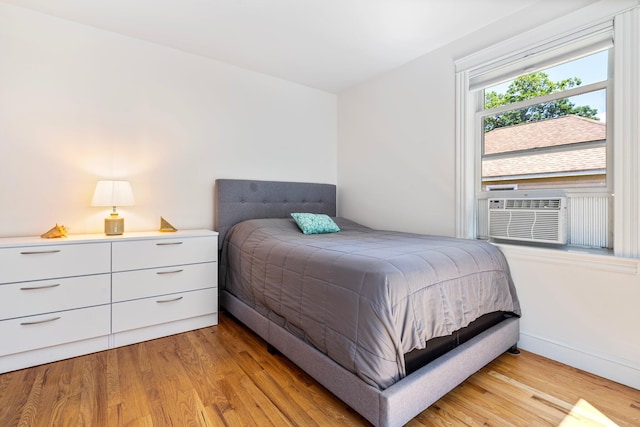 44 Yale St, Portland, ME 04103 - bedroom with light wood-style flooring, cooling unit, and baseboards