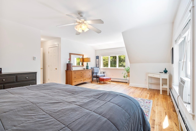 44 Yale St, Portland, ME 04103 - bedroom featuring baseboard heating, wood finished floors, a ceiling fan, and lofted ceiling